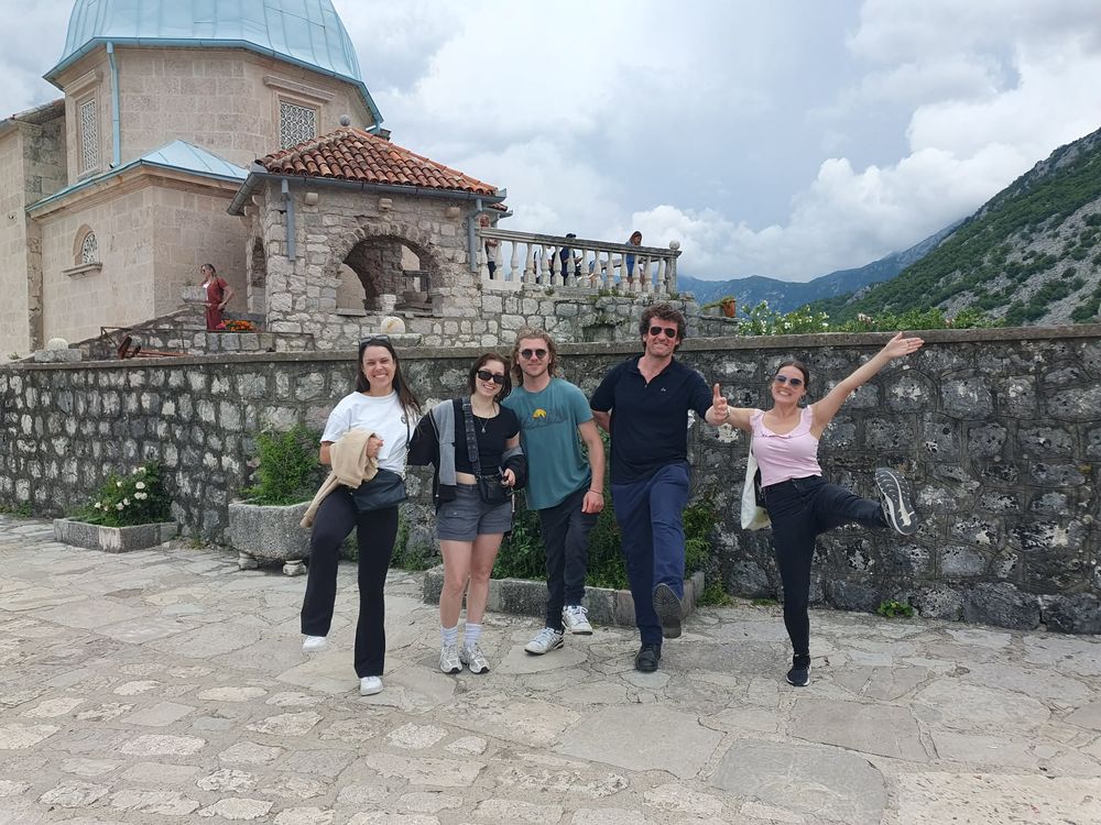 The group messing about on the waterfront at Perast, Montenegro